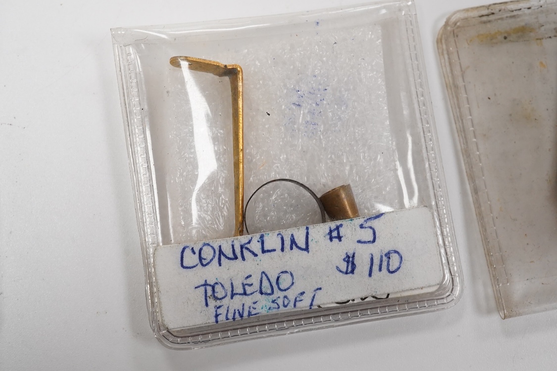 A selection of fountain spares to include levers, blind caps and nibs, some gold